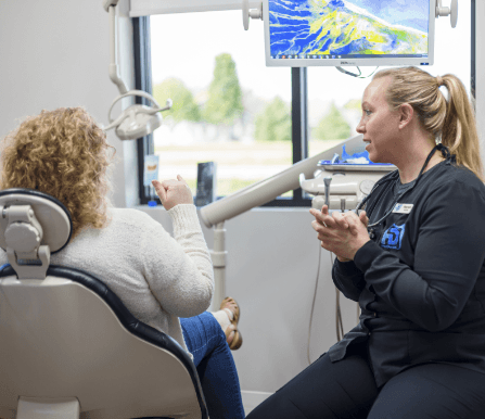 Woman's smile compared with porcelain veneers shade option