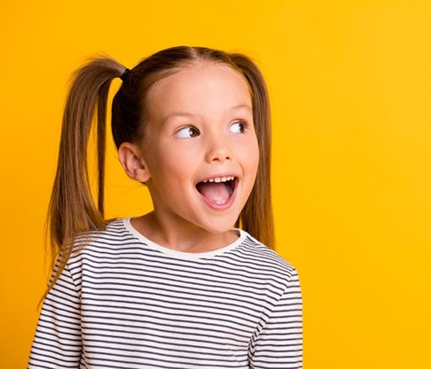 Child smiling with mouth wide open
