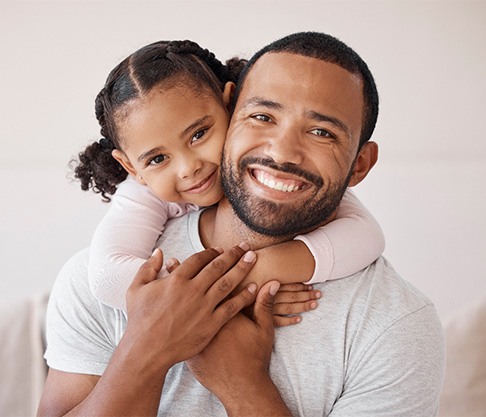 Portrait of happy father and daughter