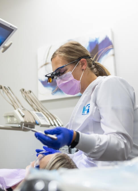 Man smiling while sitting in dental treatment chair