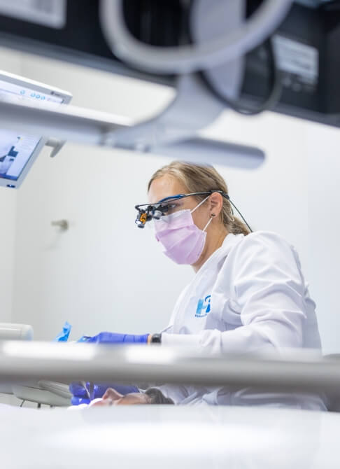 woman smiling after getting dental crowns in Mankato