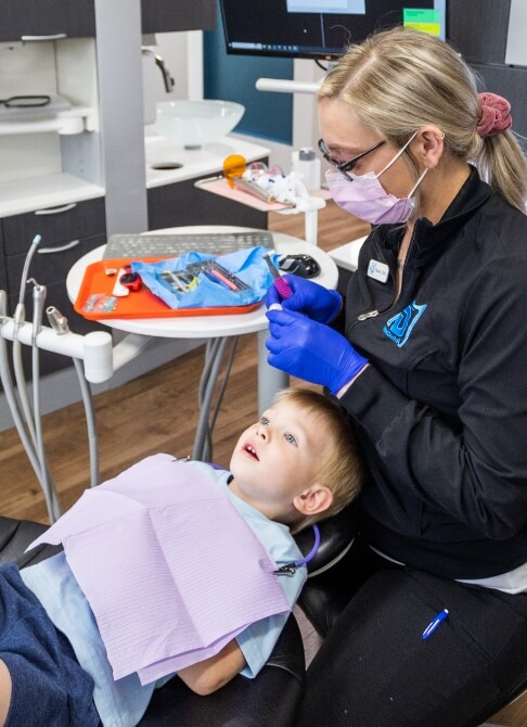 Mother and baby smiling after frenectomy in Mankato